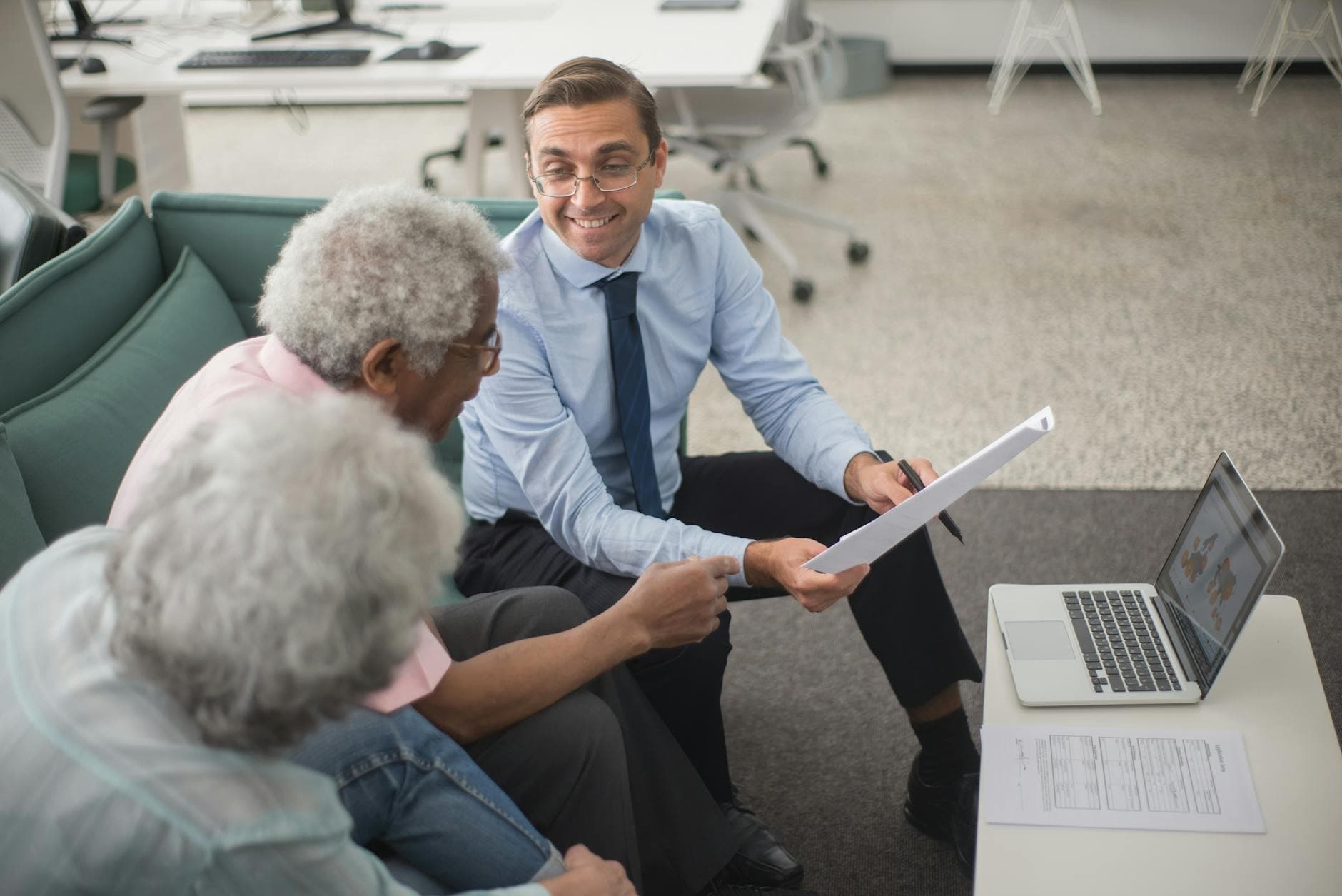 Insurance agent reviewing a policy with a family